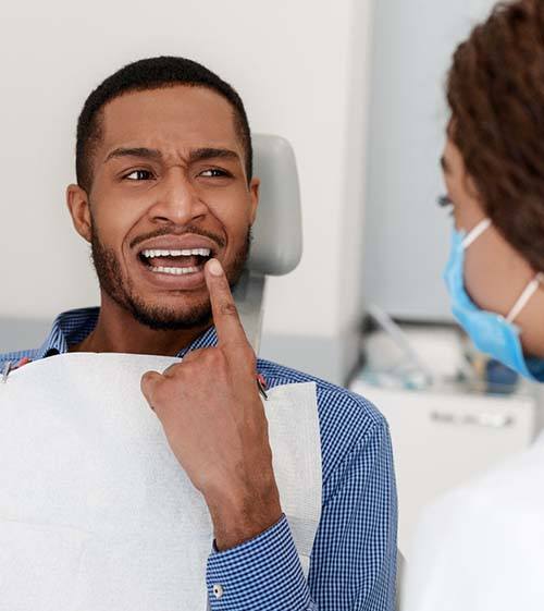 patient and North Grafton emergency dentist discussing toothaches