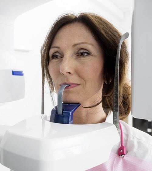 Woman receiving 3 D cone beam image scans