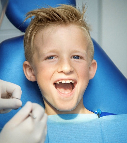 Laughing boy after tooth colored filling treatment