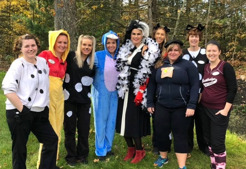 Dental team members in costumes at community event