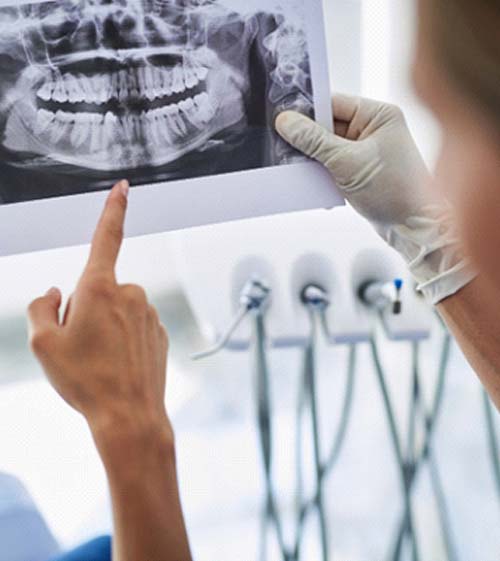 dentist and patient discussing advanced dental implant technology in North Grafton