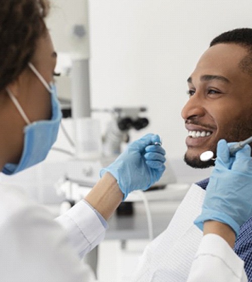 man visiting his dentist for a checkup