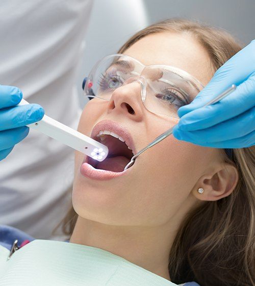 Dentist capturing images with intraoral camera