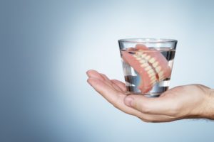 dentures in North Grafton soaking in a glass of water 